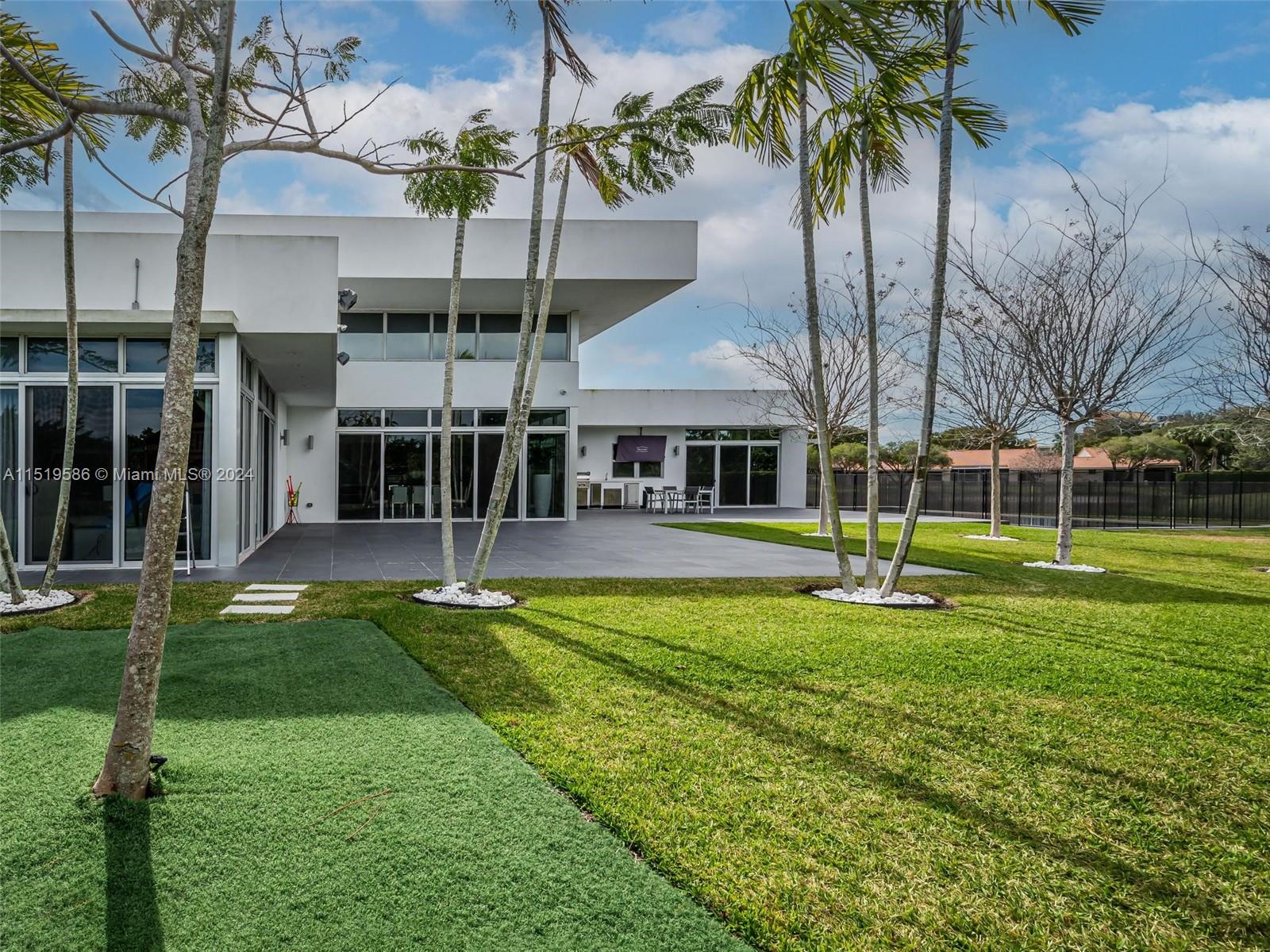 16601 Sunset Way Weston, FL 33326 - Photo 45 of 53 a view of a house with a yard patio and swimming pool