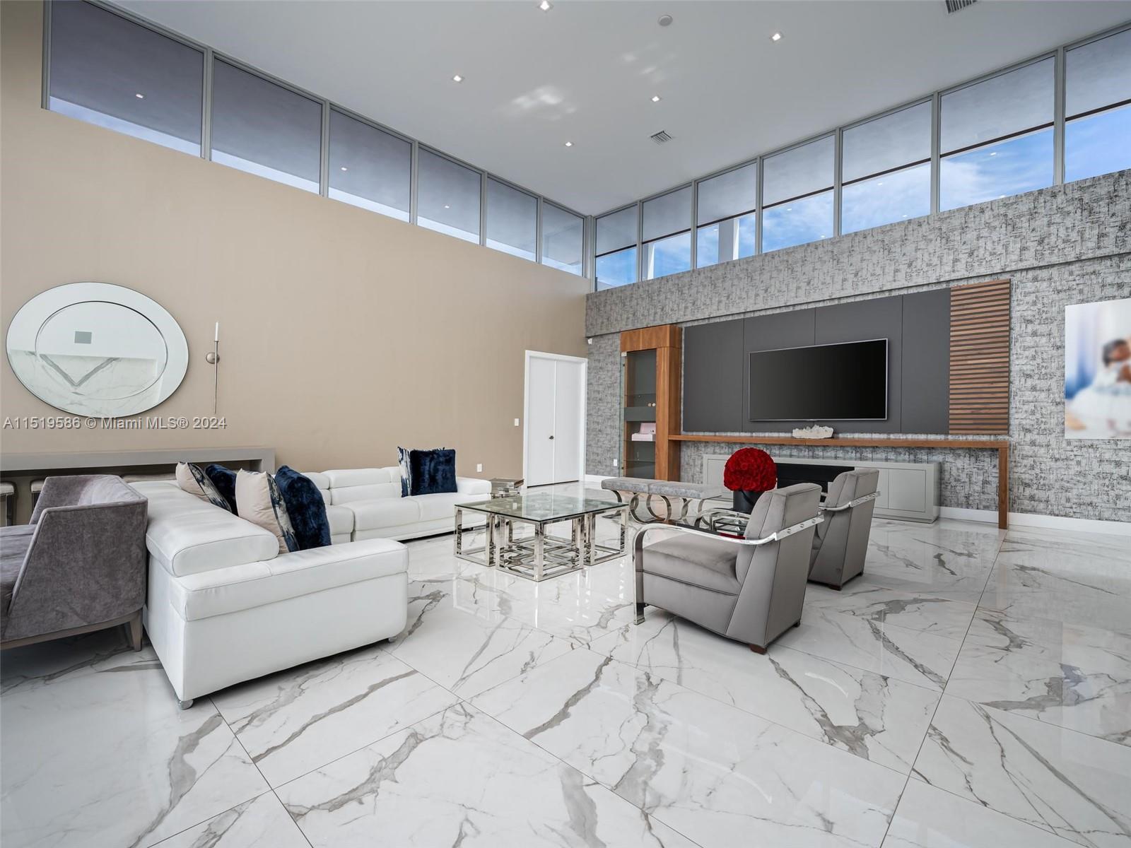 16601 Sunset Way Weston, FL 33326 - Photo 6 of 53 a living room with furniture and a flat screen tv