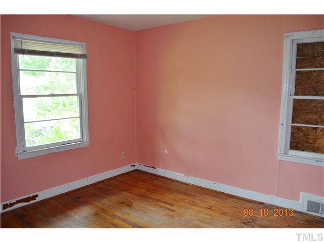 2719 Poole Road Raleigh, NC 27610 - Photo 8 of 8 an empty room with a window