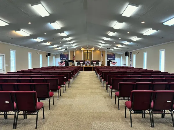 a large kitchen with a table and chairs