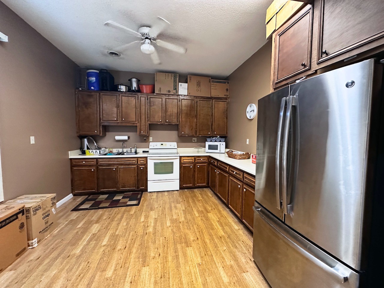 5742 Seminary Road Smyrna, TN 37167 - Photo 30 of 32 a kitchen with kitchen island a counter top space a sink stainless steel appliances and cabinets