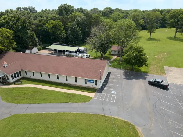 an aerial view of a house with a garden