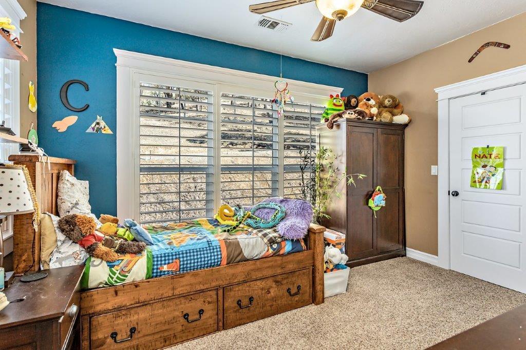 7652 Old Stage Road Central Point, OR 97502 - Photo 21 of 34 a bedroom with furniture and a window