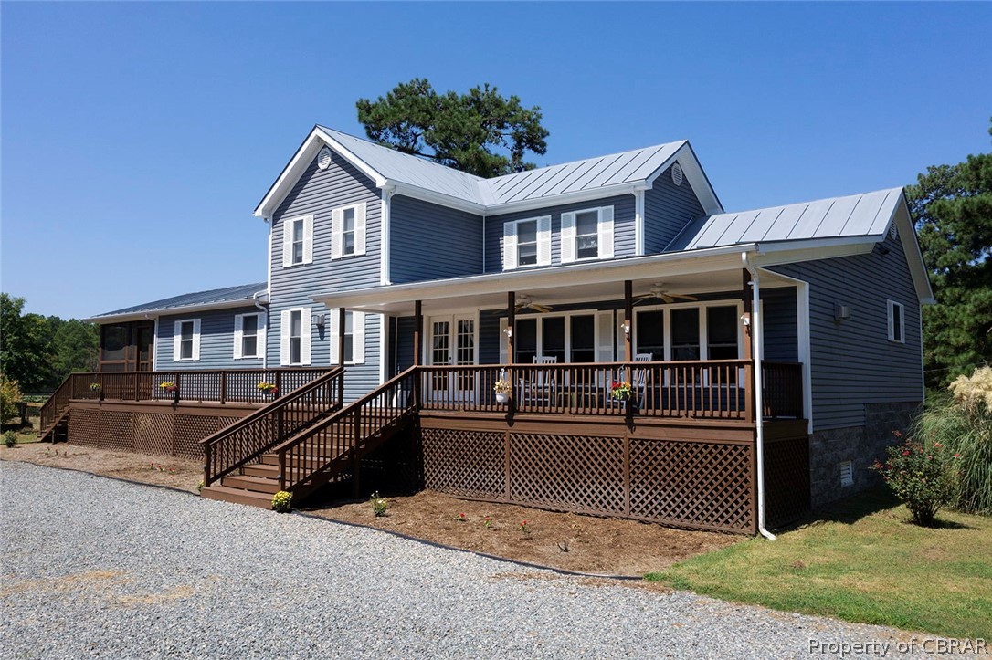 398 Kings Landing Road Onemo, VA 23130 - Photo 2 of 41 A 2006 house, raised 10 ft., offering a country front porch, side screened porch and above ground pool with a sun deck.