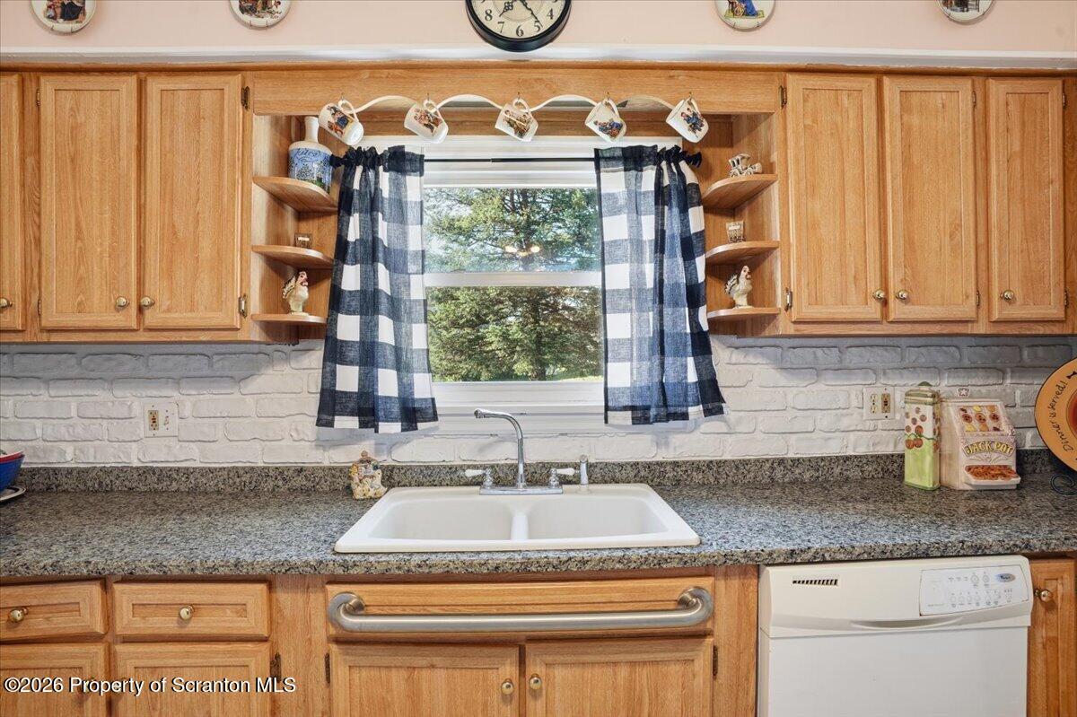 101 Stone Street Moosic, PA 18507 - Photo 8 of 53 a kitchen with granite countertop a sink and a window