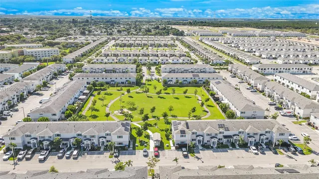 a picture of a bench in front of a gate