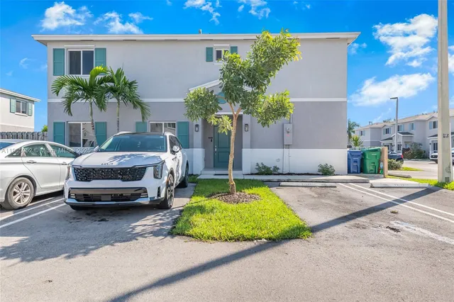 a car parked in front of a house