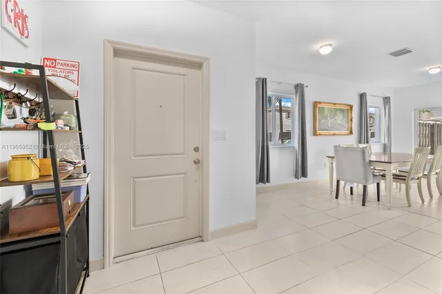 a view of a room with furniture and window