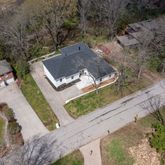a view of a house with a snow in the yard