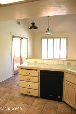 a view of room with window and ceiling fan