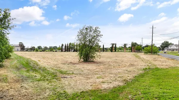 a view of a lake with a big yard