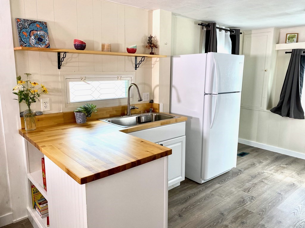 42 Adams Road, Unit 25 Greenfield, MA 01301 - Photo 11 of 37 a kitchen with a refrigerator and a sink