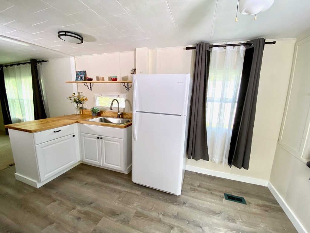 42 Adams Road, Unit 25 Greenfield, MA 01301 - Photo 14 of 37 a kitchen with a refrigerator a sink and dishwasher
