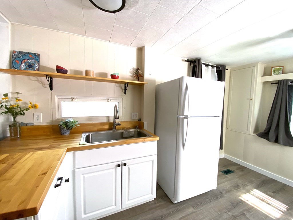 42 Adams Road, Unit 25 Greenfield, MA 01301 - Photo 19 of 37 a kitchen with a refrigerator and a sink