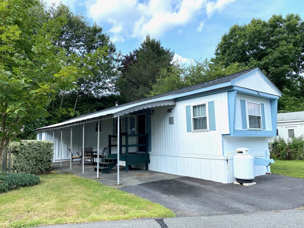 42 Adams Road, Unit 25 Greenfield, MA 01301 - Photo 2 of 37 a view of a house with backyard and sitting area