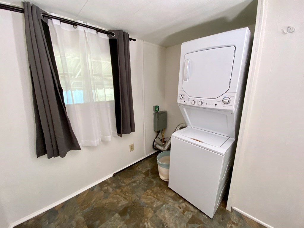42 Adams Road, Unit 25 Greenfield, MA 01301 - Photo 25 of 37 a bathroom with a sink a mirror a toilet and a window