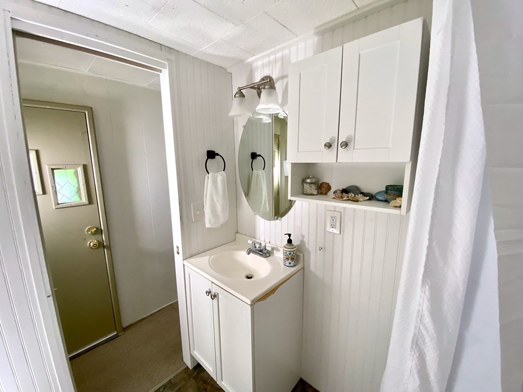 42 Adams Road, Unit 25 Greenfield, MA 01301 - Photo 30 of 37 a bathroom with a sink vanity and a mirror