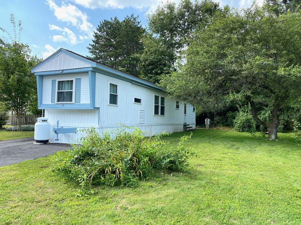 42 Adams Road, Unit 25 Greenfield, MA 01301 - Photo 4 of 37 a front view of house with a garden