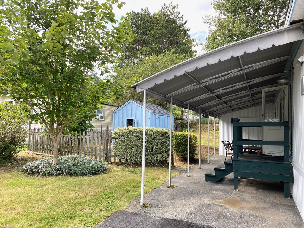 42 Adams Road, Unit 25 Greenfield, MA 01301 - Photo 5 of 37 a view of a house with backyard and a patio