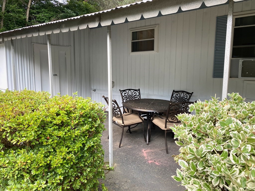 42 Adams Road, Unit 25 Greenfield, MA 01301 - Photo 7 of 37 a backyard of a house with outdoor seating