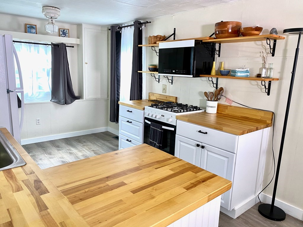 42 Adams Road, Unit 25 Greenfield, MA 01301 - Photo 10 of 37 a kitchen with a sink appliances and cabinets