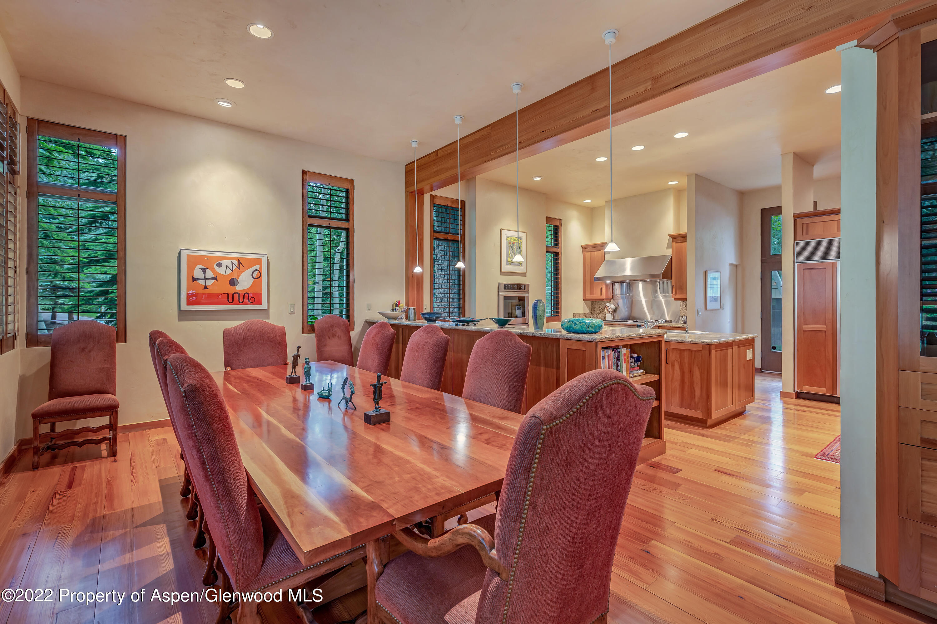332 Glen Eagle Drive Aspen, CO 81611 - Photo 11 of 37 a view of a dining room with furniture and wooden floor