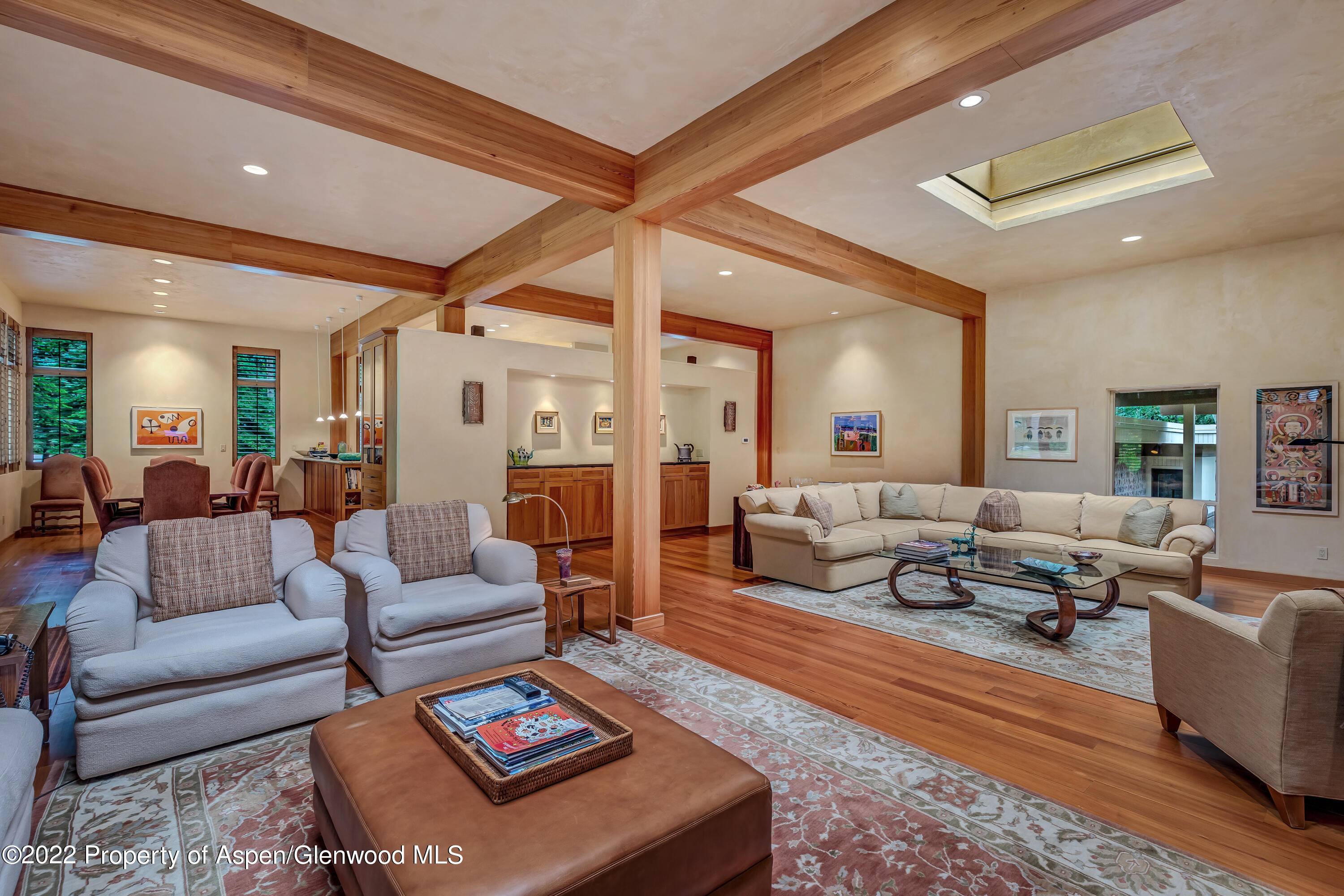 332 Glen Eagle Drive Aspen, CO 81611 - Photo 15 of 37 a living room with furniture wooden floor and a large window