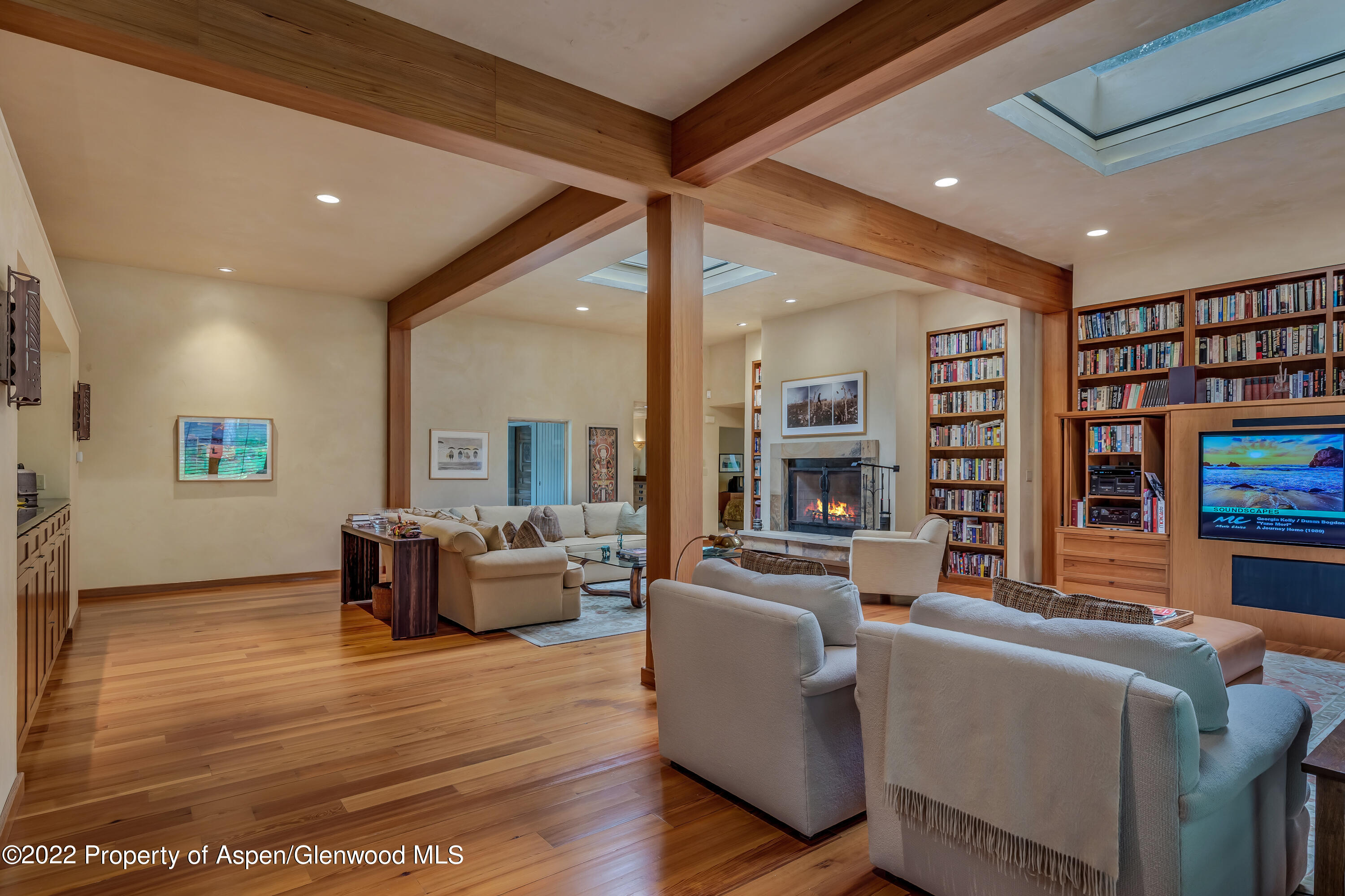 332 Glen Eagle Drive Aspen, CO 81611 - Photo 17 of 37 a living room with furniture and a book shelf