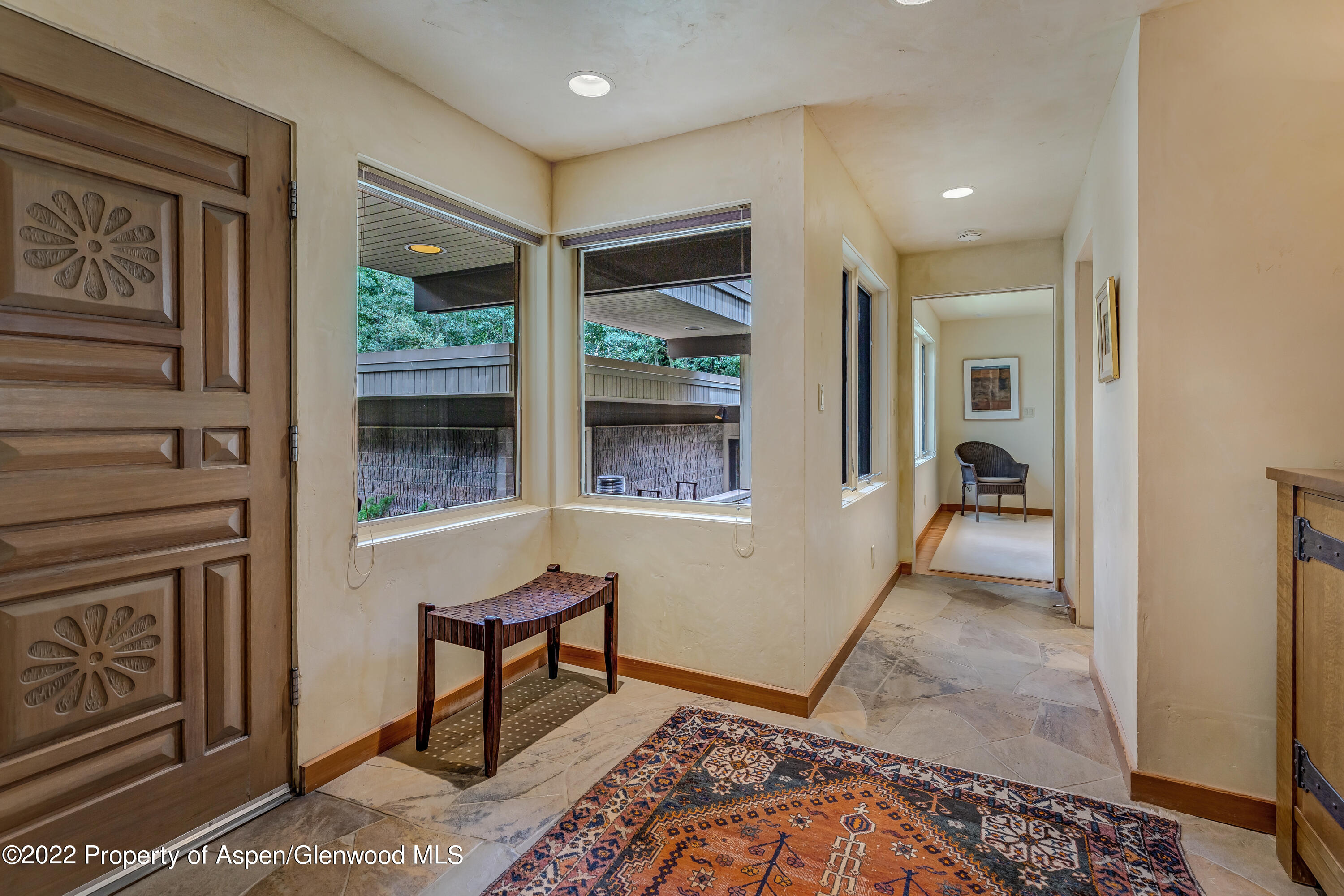 332 Glen Eagle Drive Aspen, CO 81611 - Photo 2 of 37 a view of hallway with furniture and a window