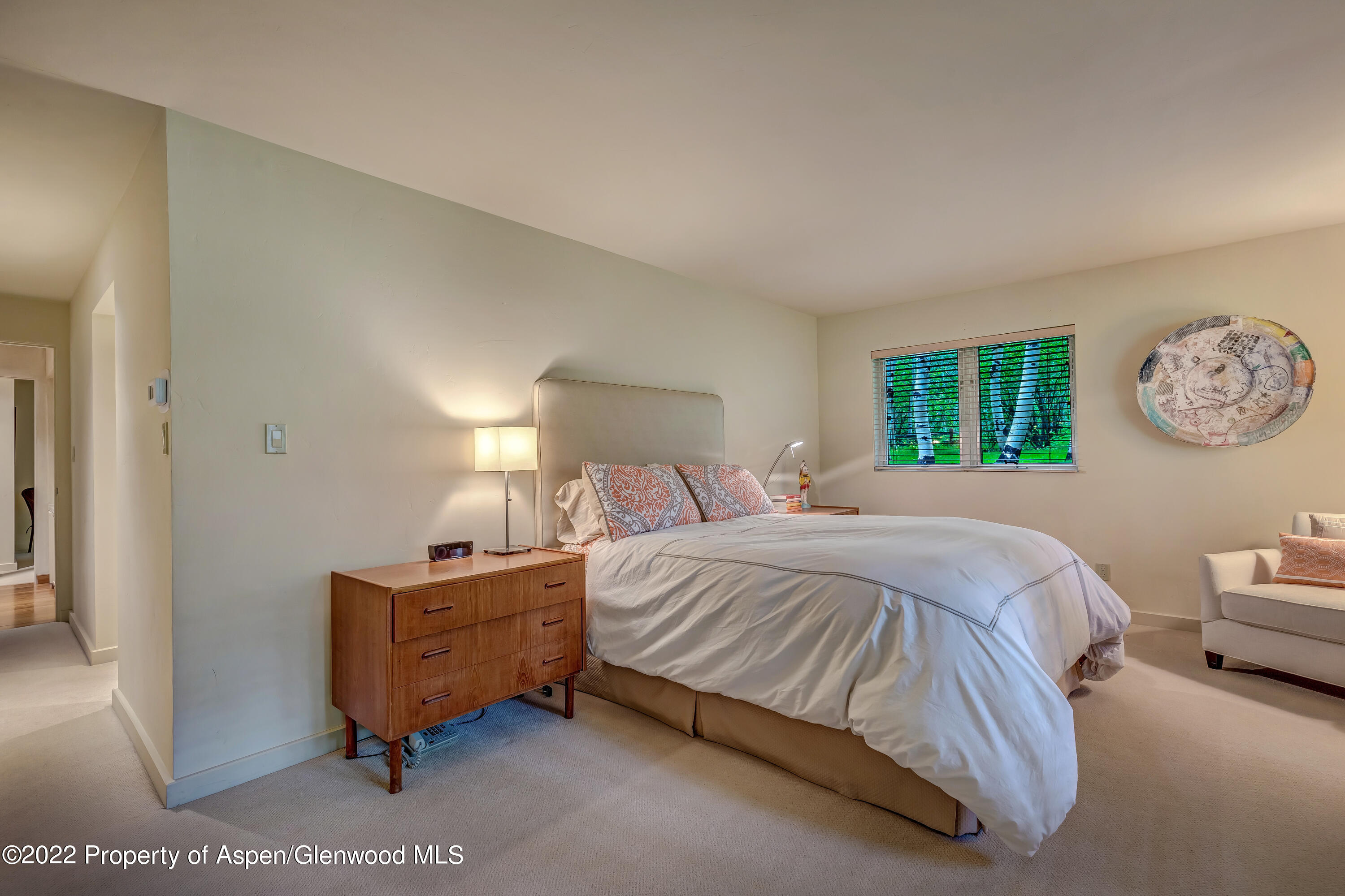 332 Glen Eagle Drive Aspen, CO 81611 - Photo 23 of 37 a bedroom with a bed and a lamp on dresser