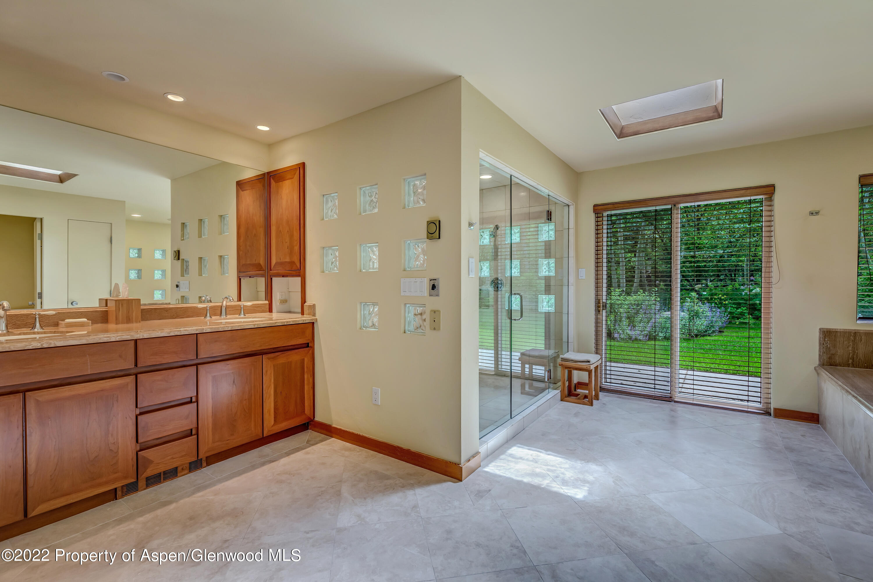 332 Glen Eagle Drive Aspen, CO 81611 - Photo 25 of 37 a view of a room with gym equipment and floor to ceiling window