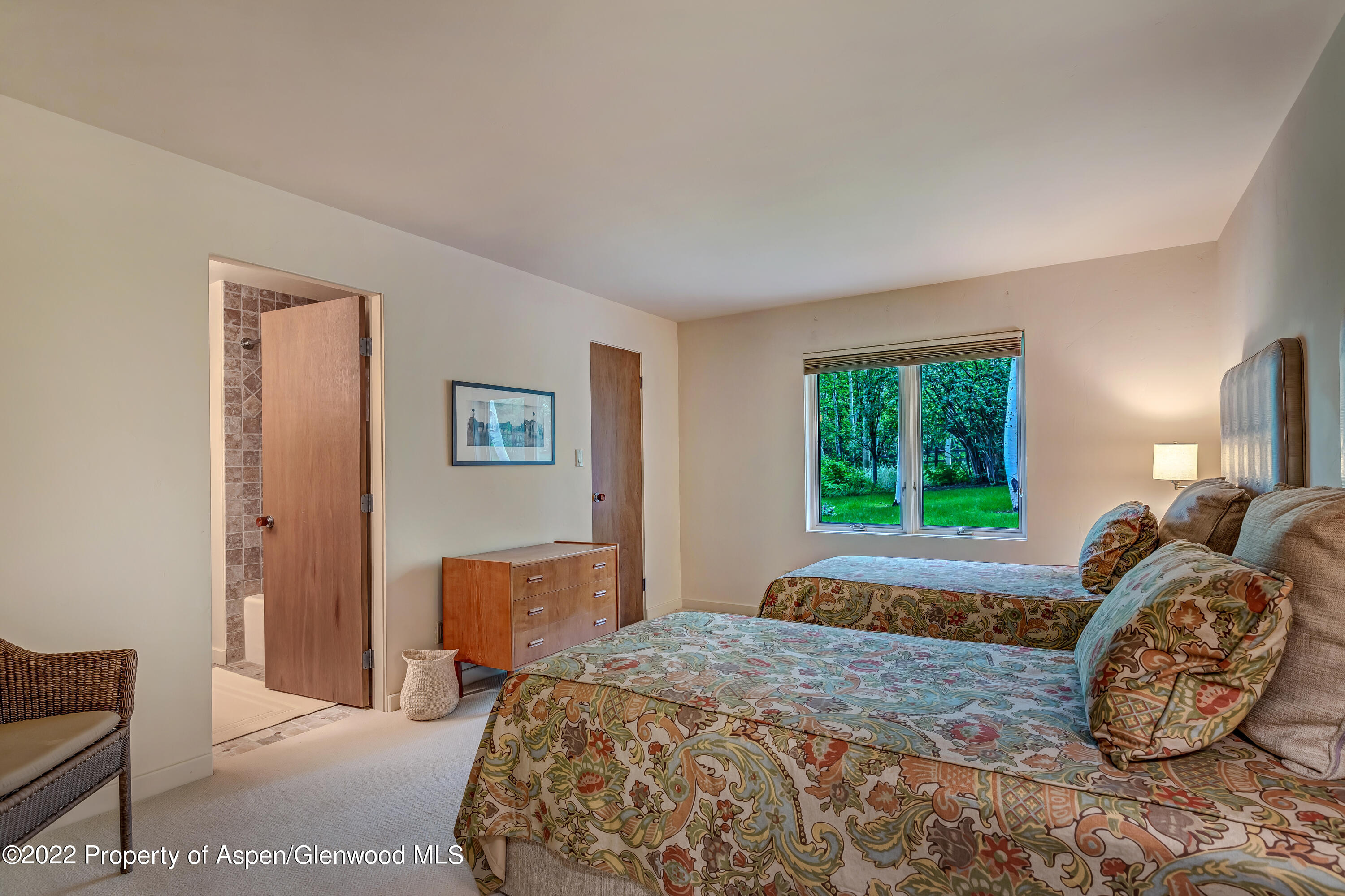 332 Glen Eagle Drive Aspen, CO 81611 - Photo 26 of 37 a bedroom with a bed and window