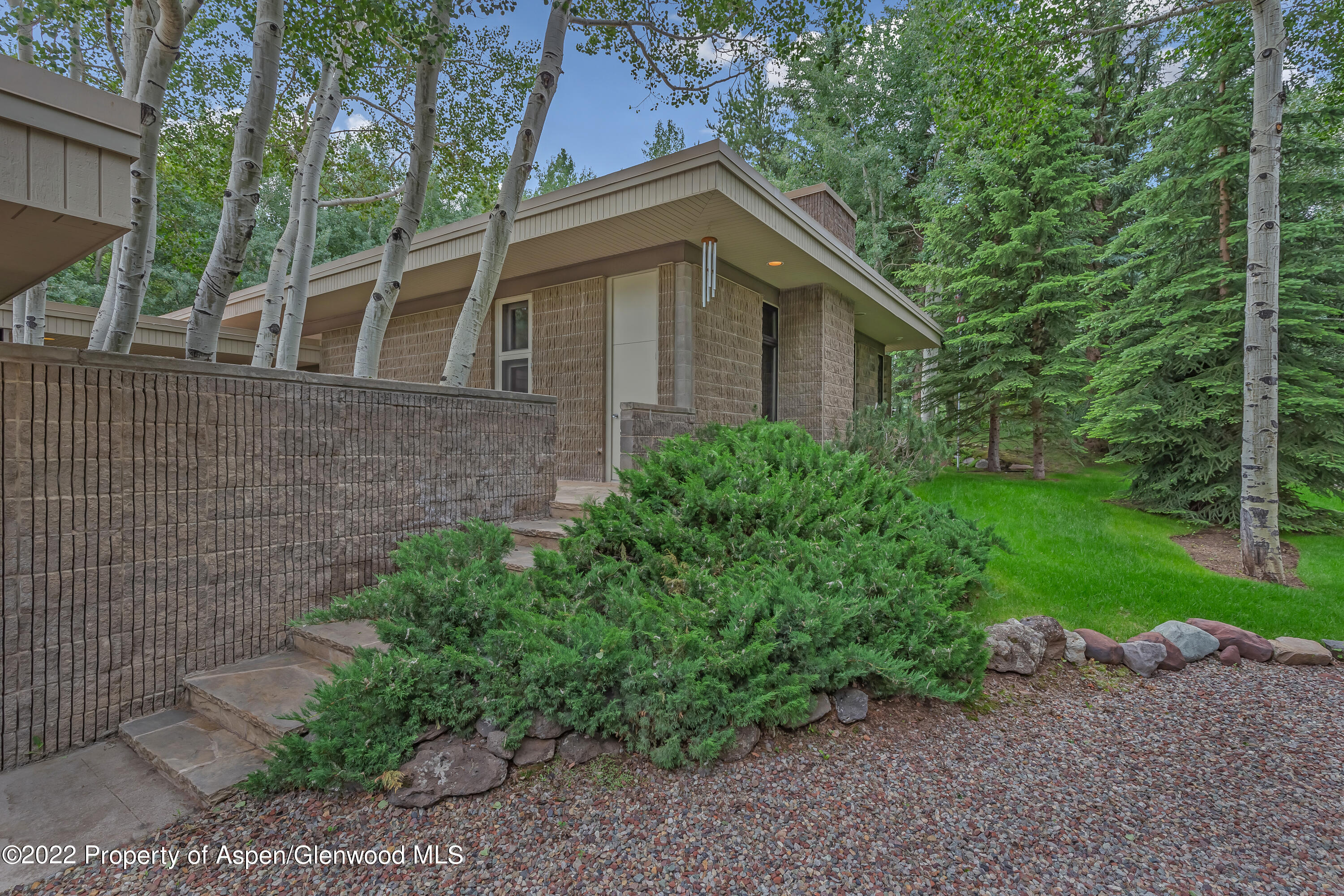 332 Glen Eagle Drive Aspen, CO 81611 - Photo 33 of 37 a view of a house with a yard