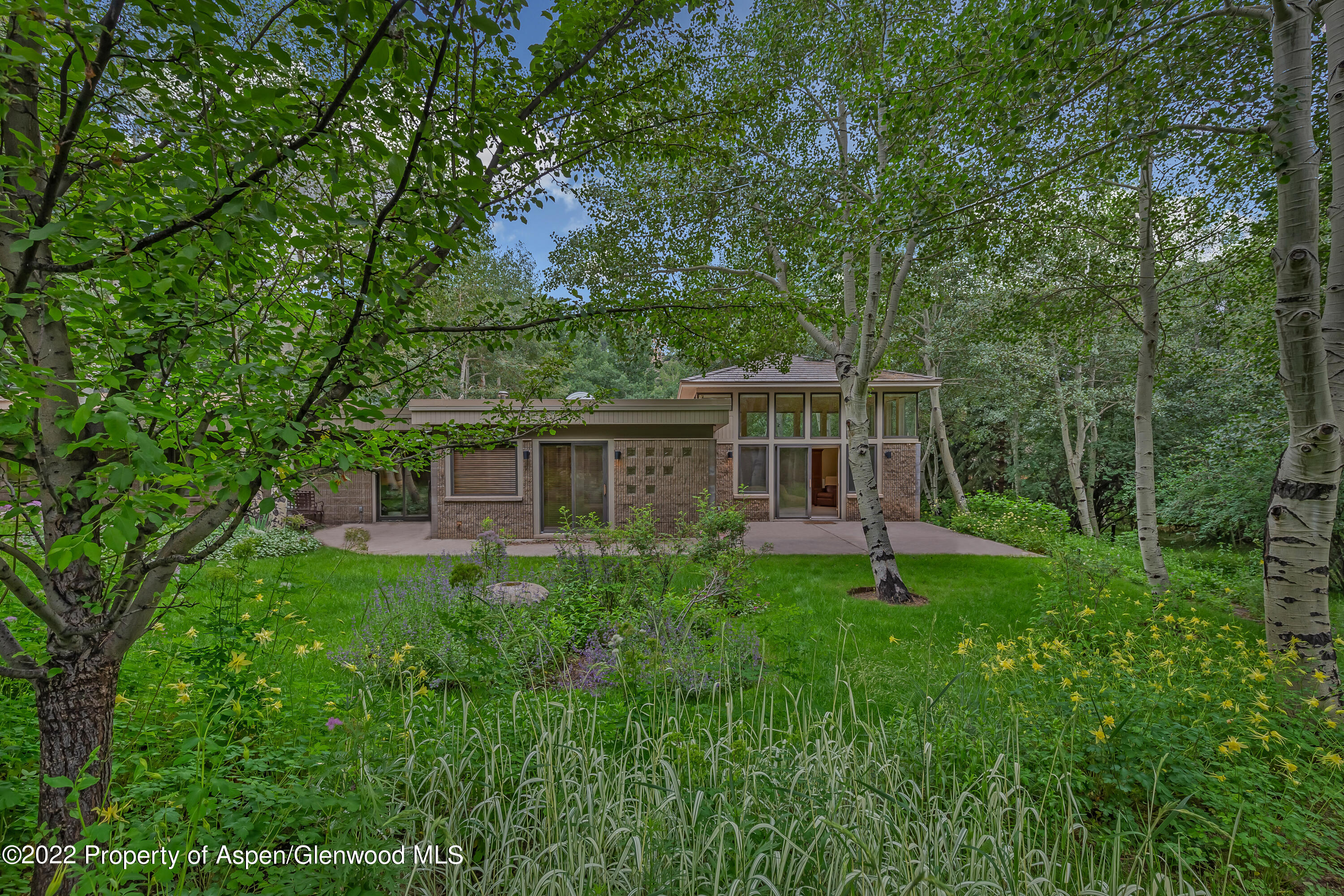 332 Glen Eagle Drive Aspen, CO 81611 - Photo 36 of 37 a backyard of a house with seating space