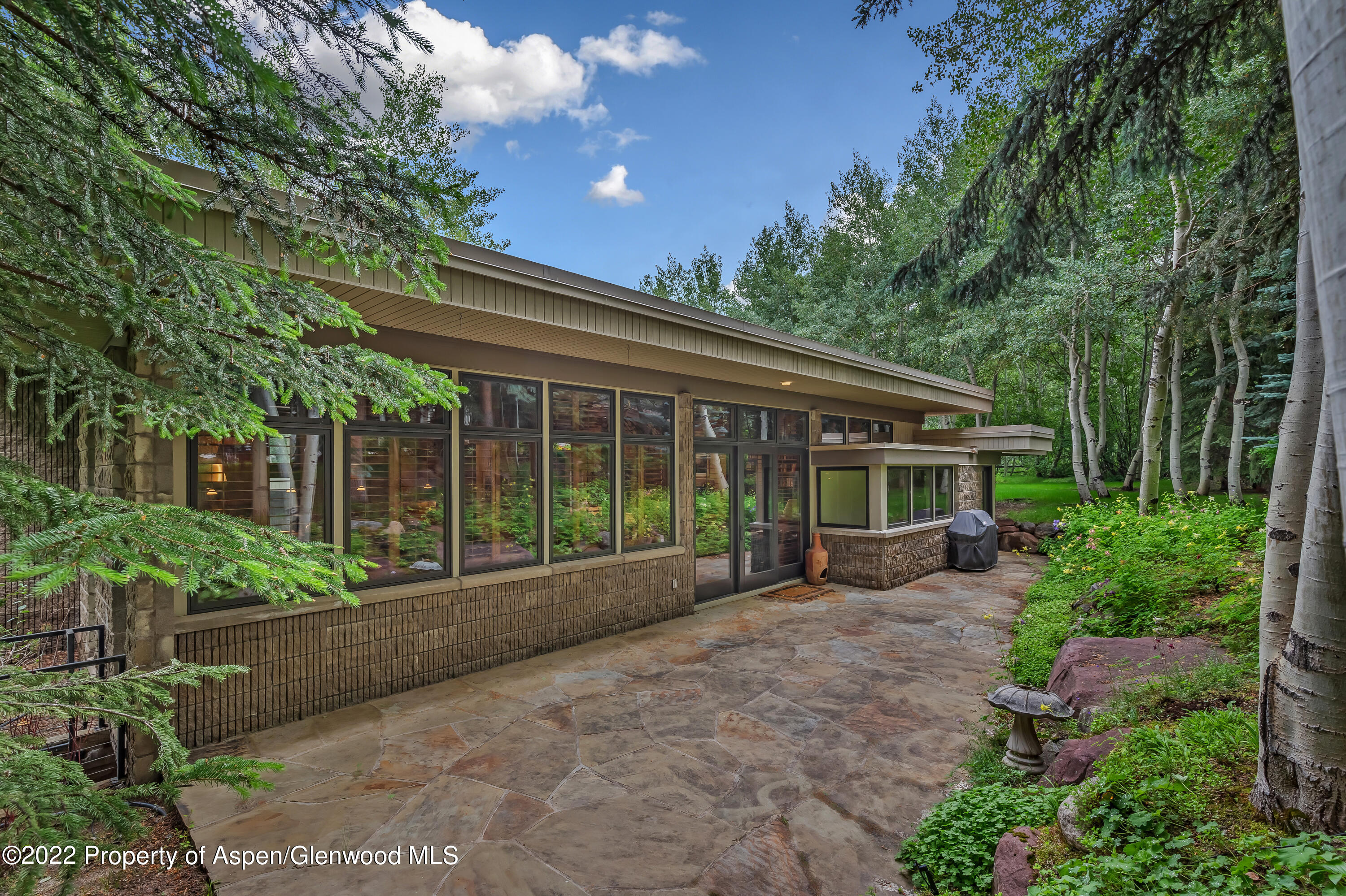 332 Glen Eagle Drive Aspen, CO 81611 - Photo 37 of 37 a view of house with a yard and sitting area