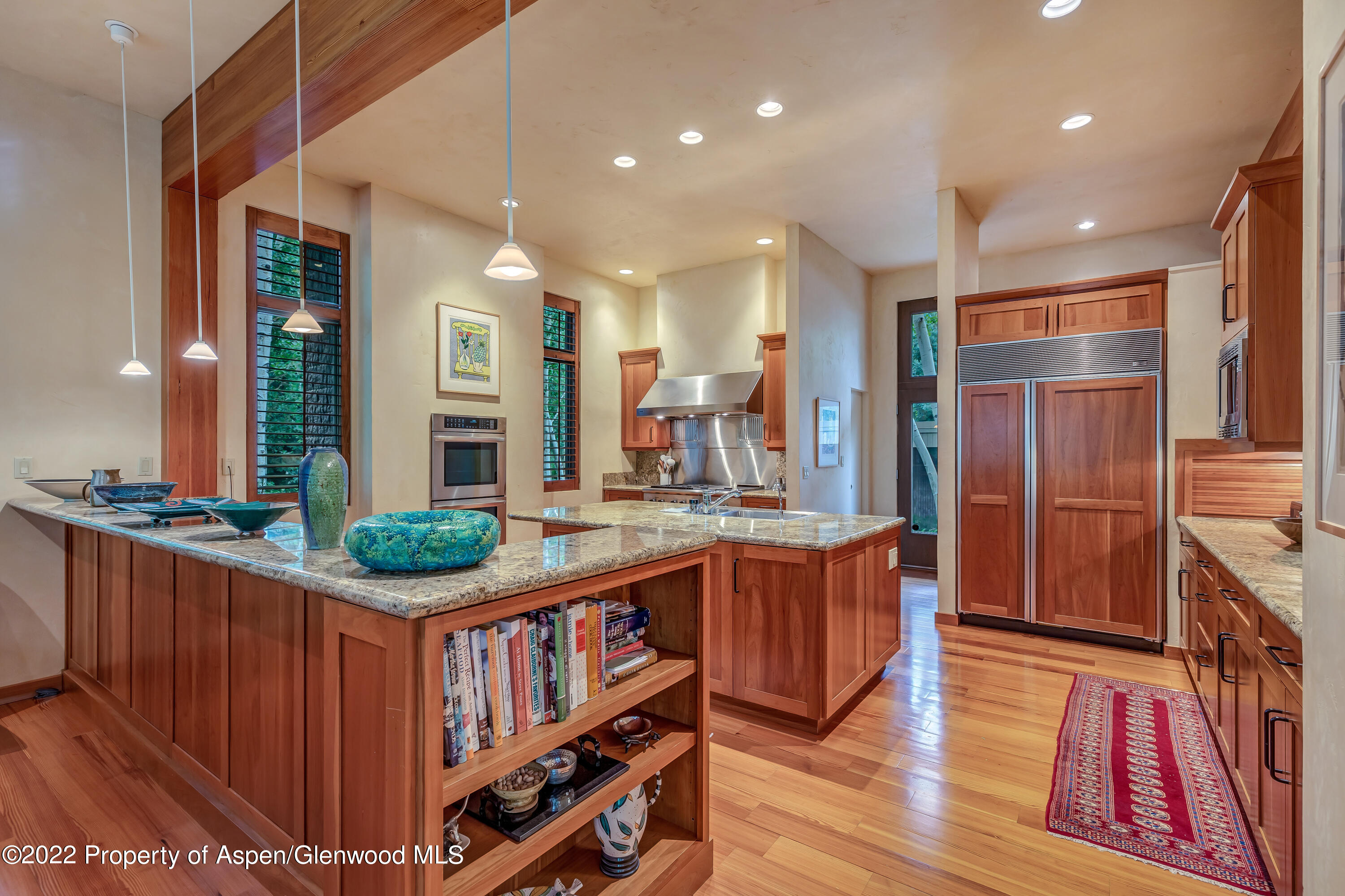 332 Glen Eagle Drive Aspen, CO 81611 - Photo 6 of 37 a kitchen with stainless steel appliances granite countertop a stove a sink dishwasher and a refrigerator
