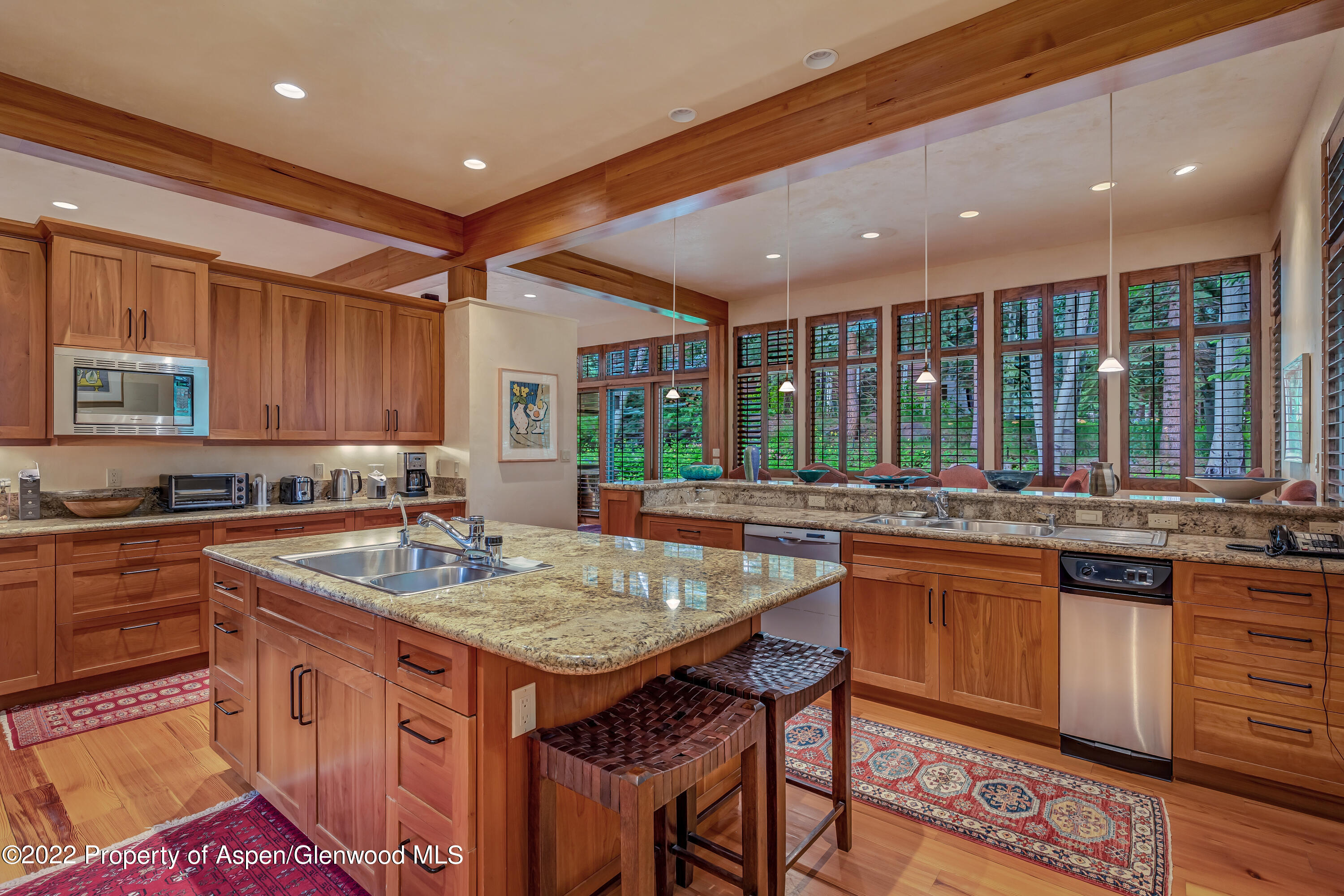 332 Glen Eagle Drive Aspen, CO 81611 - Photo 7 of 37 a kitchen with a stove sink and cabinets