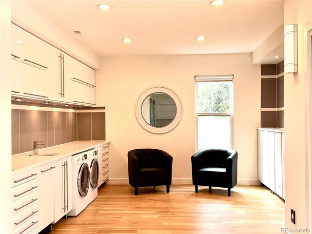 a living room with furniture a window and a fireplace