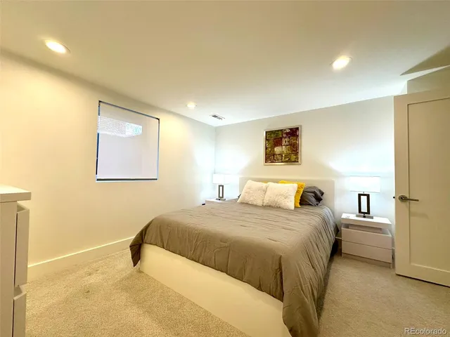 a bedroom with a bed and a view of bedroom