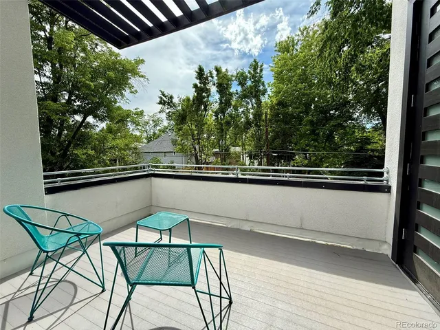 a view of a balcony with chairs