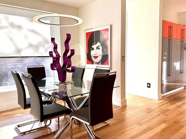 a view of a dining room with furniture and chandelier