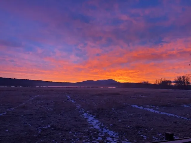 a view of mountain and sunset