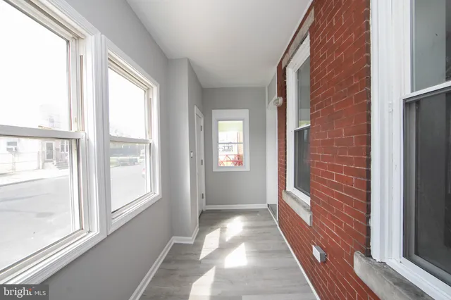 a view of a hallway with windows