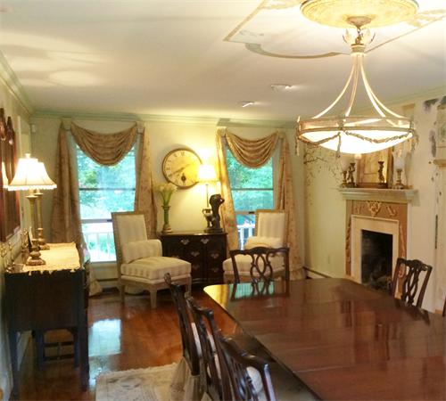 122 Maple Avenue Rutland, MA 01543 - Photo 17 of 30 a living room with furniture a fireplace and a chandelier