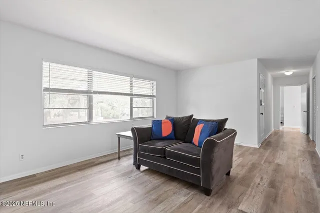 a living room with furniture and a window