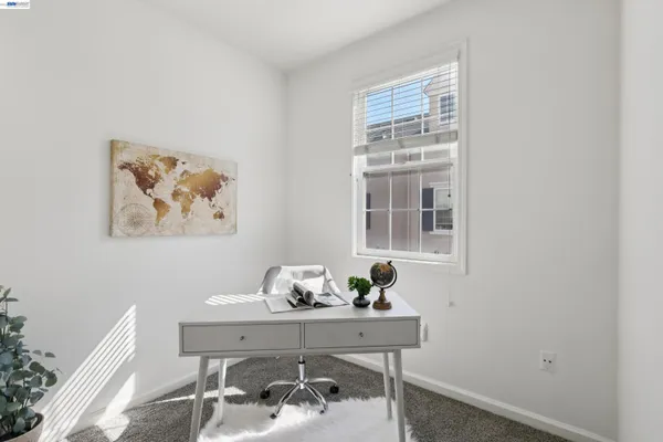 a view of a workspace with furniture
