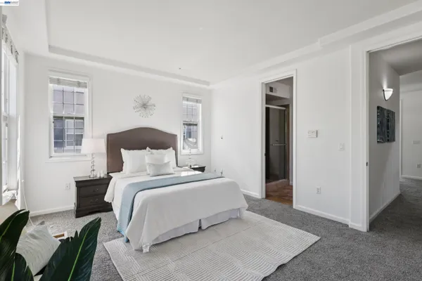 a bedroom with a bed and a couch