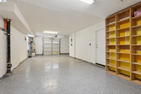 a view of an empty room with a empty shelves