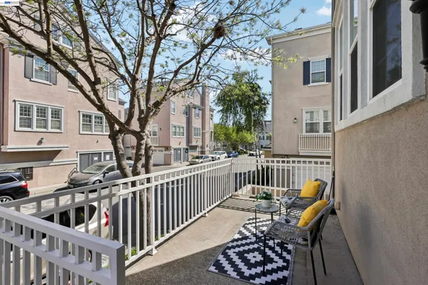 a view of a chair and table in the balcony