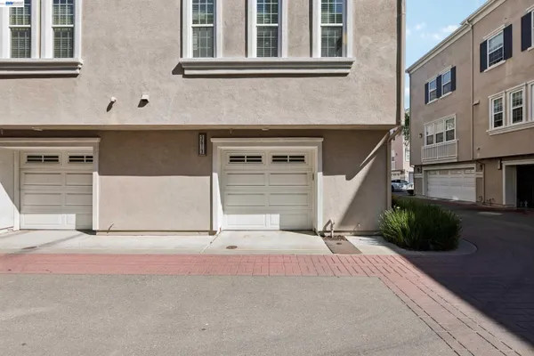 a view of a house with more windows and plants